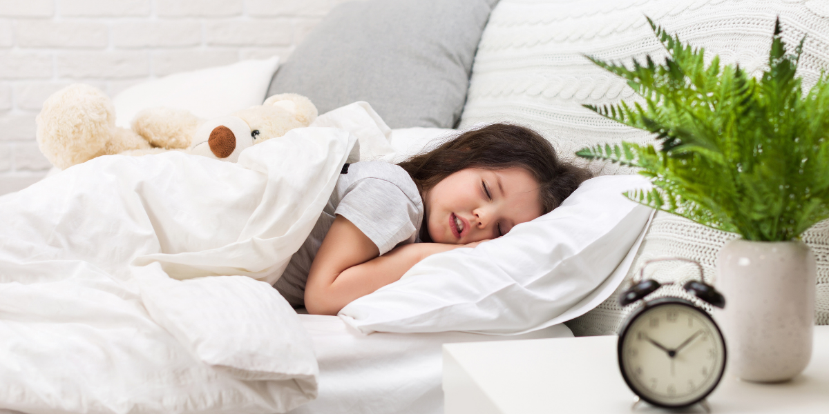 Child with snoring issues that could improve sleep with optimized dental health.