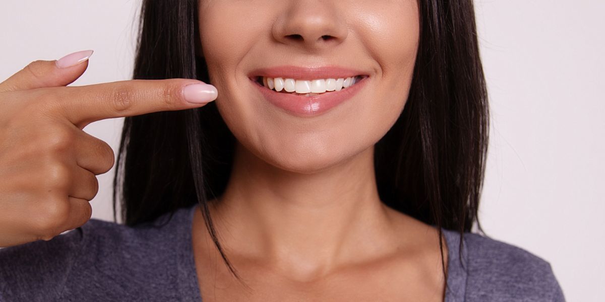 smiling dental patient preventing symptoms of gum disease
