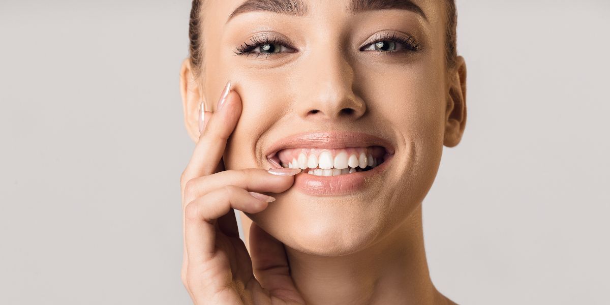 Woman with healthy smile excited about modern dentistry